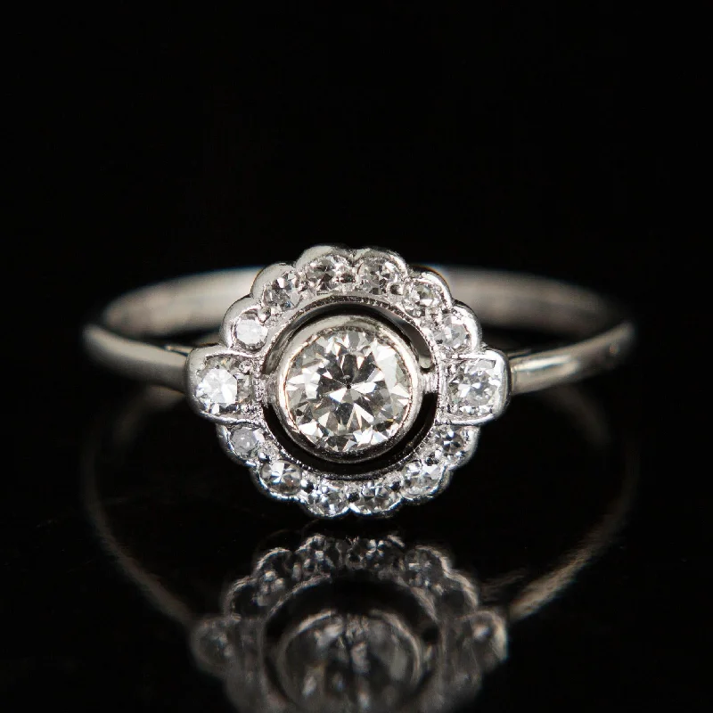 women's rings celestial theme -Platinum Diamond Halo Ring | Circa 1920